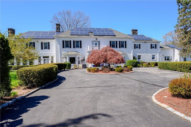 view of front of house with solar panels