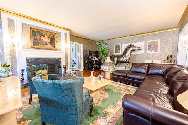 living room with crown molding, a fireplace, and hardwood / wood-style flooring