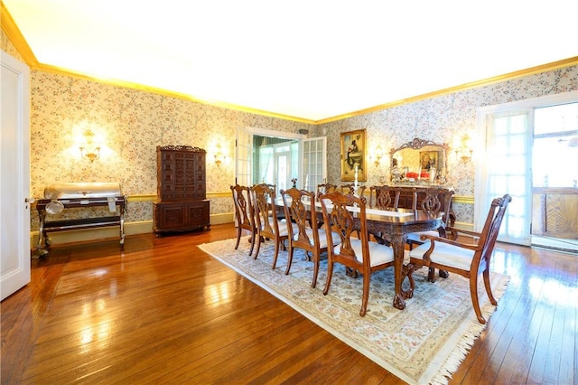 dining area featuring hardwood / wood-style flooring and ornamental molding