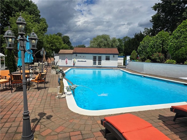 view of pool featuring a patio area