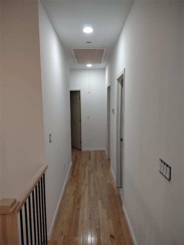 corridor featuring light hardwood / wood-style floors