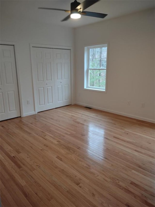 unfurnished bedroom with light hardwood / wood-style flooring and ceiling fan