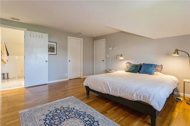 bedroom featuring wood-type flooring