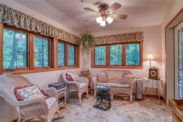 sitting room with ceiling fan and a wealth of natural light