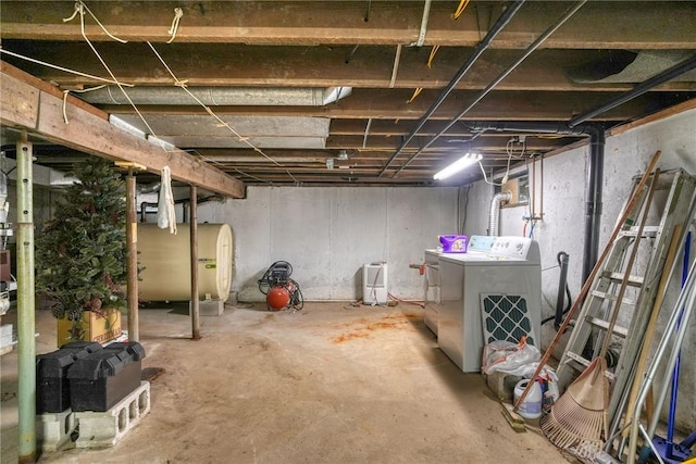 basement with washer and clothes dryer