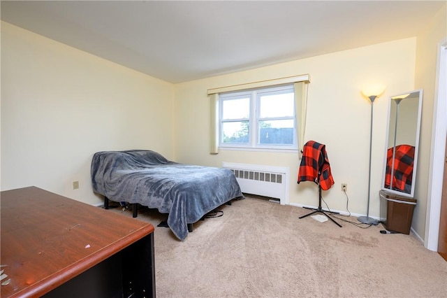 carpeted bedroom featuring radiator heating unit