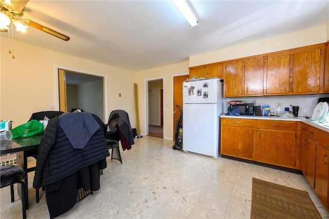 kitchen featuring white fridge and ceiling fan