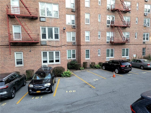245 Rumsey Rd Unit 7B, Yonkers, NY 10701 - view of apartment building / complex featuring uncovered parking