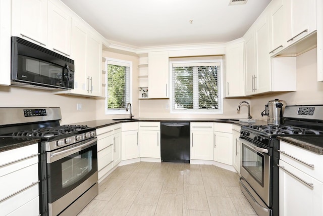 kitchen featuring white cabinets, sink, dark stone counters, and black appliances