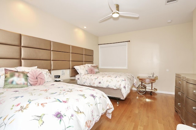 bedroom with light wood-type flooring and ceiling fan