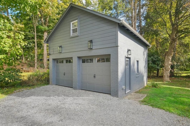 view of side of home featuring a garage