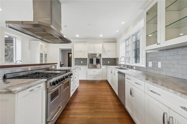 kitchen featuring white cabinets, sink, stainless steel appliances, and extractor fan