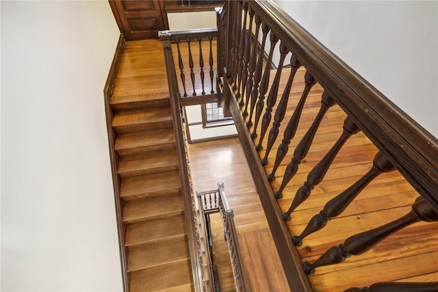 stairs with wood-type flooring