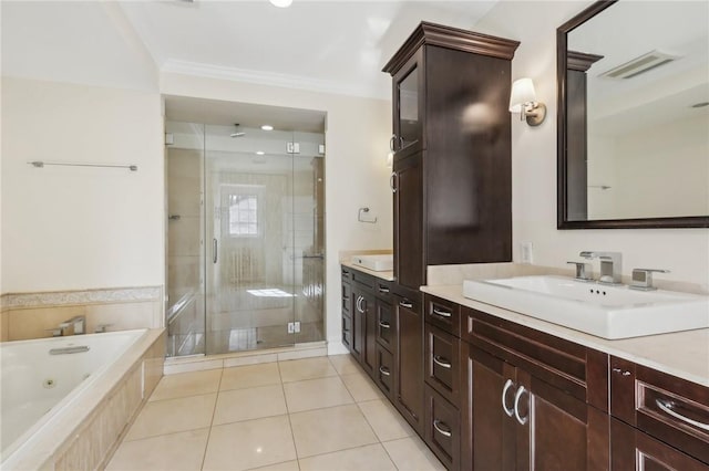 bathroom with tile patterned flooring, vanity, ornamental molding, and shower with separate bathtub