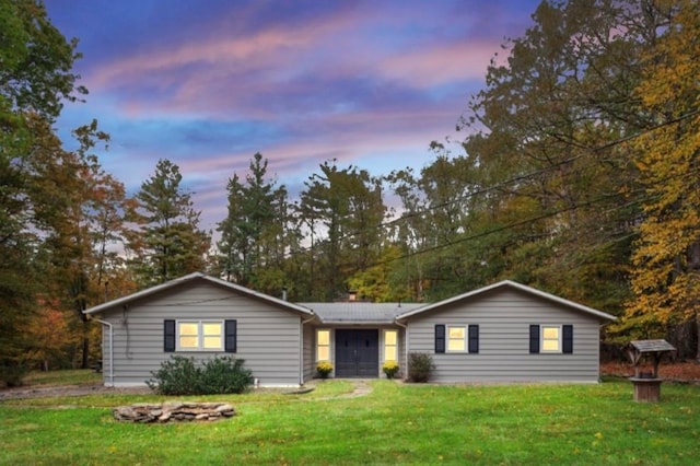 ranch-style house featuring a yard