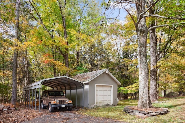 exterior space featuring a carport and a detached garage