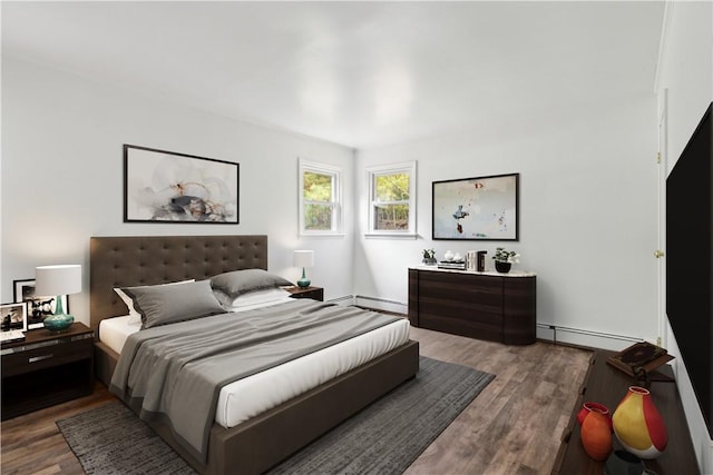bedroom featuring wood finished floors, a baseboard heating unit, and baseboard heating