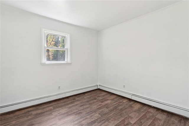 empty room with wood finished floors and baseboard heating