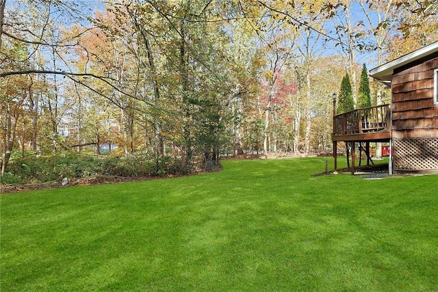 view of yard featuring a wooden deck