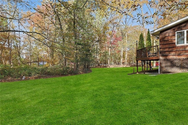 view of yard featuring a wooden deck