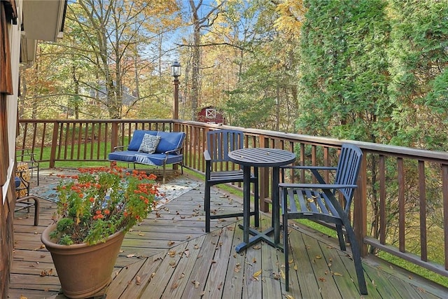 wooden deck with an outdoor living space