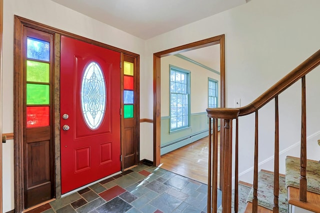 entryway with a baseboard heating unit and dark wood-type flooring