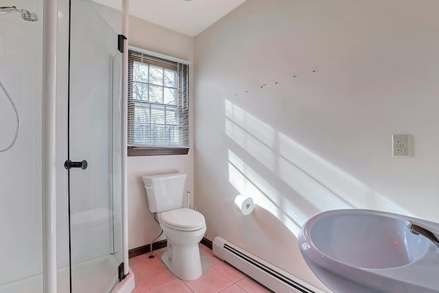 bathroom with tile patterned floors, a shower with door, and toilet