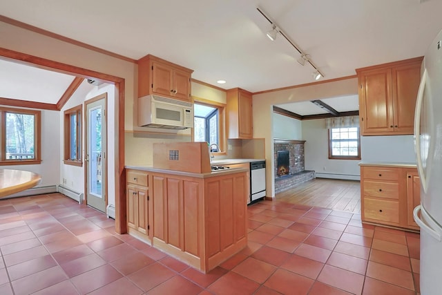 kitchen with light wood-type flooring, rail lighting, white appliances, a baseboard heating unit, and lofted ceiling