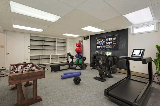 gym featuring a drop ceiling and carpet floors