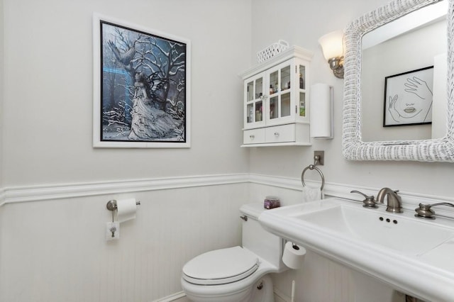 bathroom with toilet and sink