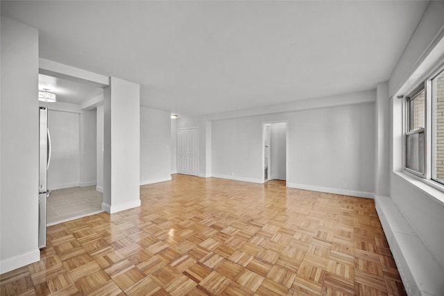 spare room featuring light parquet flooring