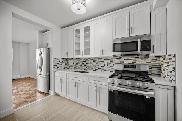 kitchen featuring sink, white cabinetry, and stainless steel appliances