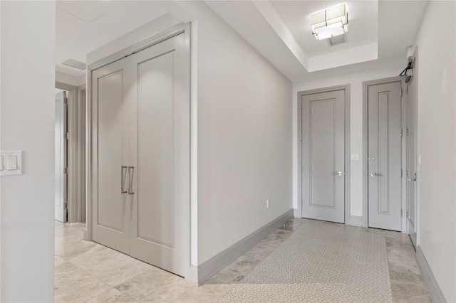 foyer featuring a tray ceiling