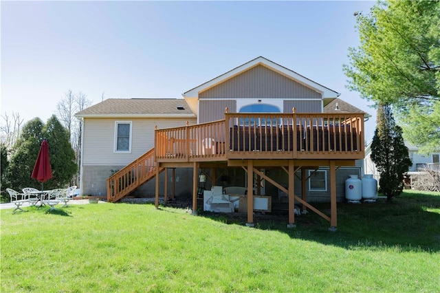 rear view of property featuring a lawn and a wooden deck