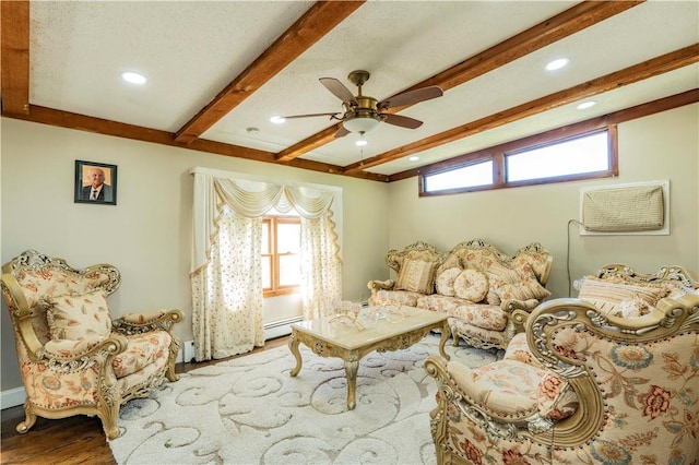 living room with beam ceiling, ceiling fan, light hardwood / wood-style flooring, and a baseboard radiator