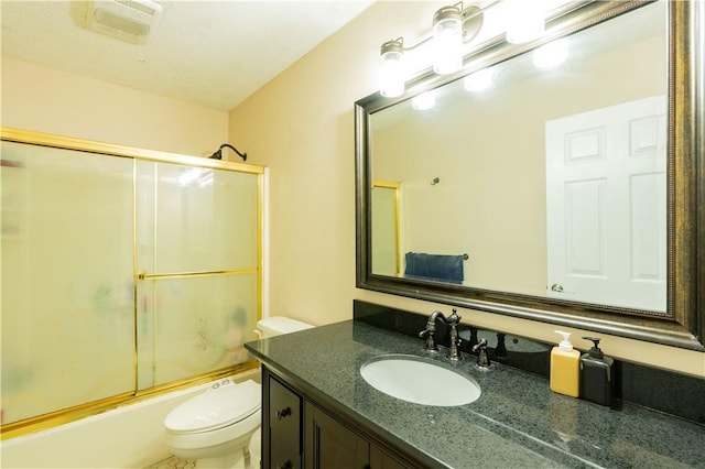 full bathroom featuring shower / bath combination with glass door, vanity, and toilet