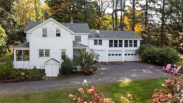 view of front of house featuring a front yard and a garage