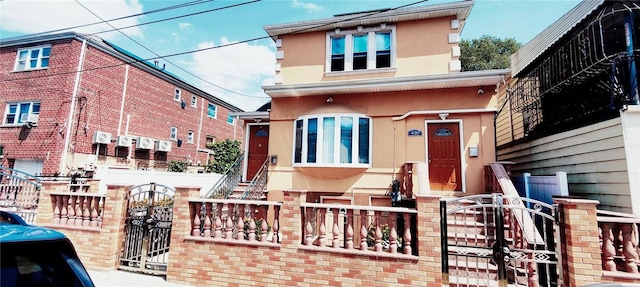 view of front of property with cooling unit