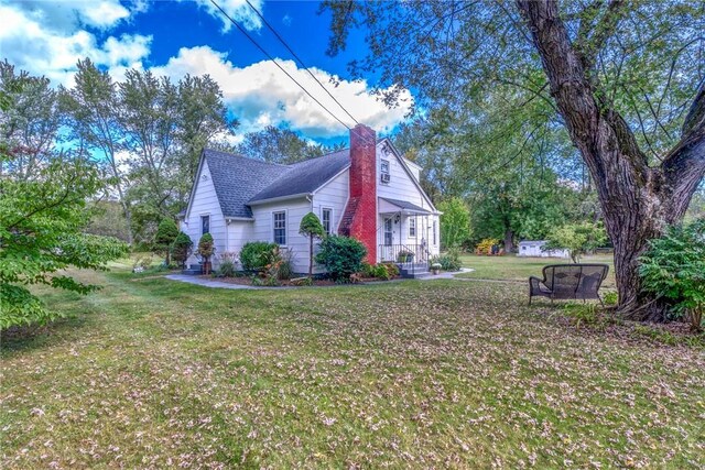 179 Grove St, Tillson, NY 12486 - view of side of property with a chimney, a lawn, and a shingled roof