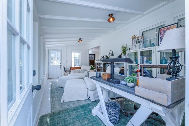 living room with vaulted ceiling with beams and french doors