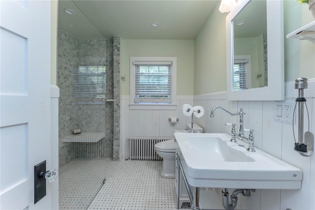 179 Grove St, Tillson, NY 12486 - full bath featuring radiator heating unit, a tile shower, wainscoting, toilet, and a sink