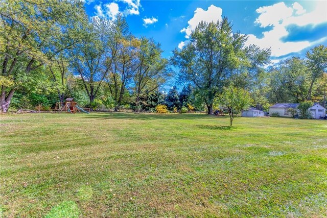 179 Grove St, Tillson, NY 12486 - view of grassy yard with a playground and view of scattered trees