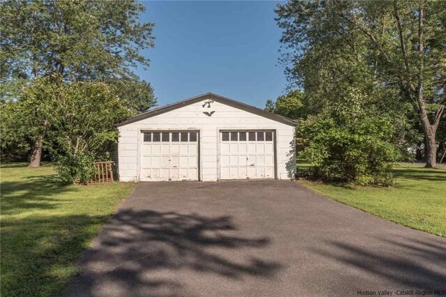 garage with a yard