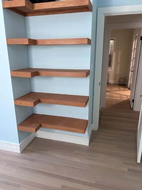 stairway featuring hardwood / wood-style floors