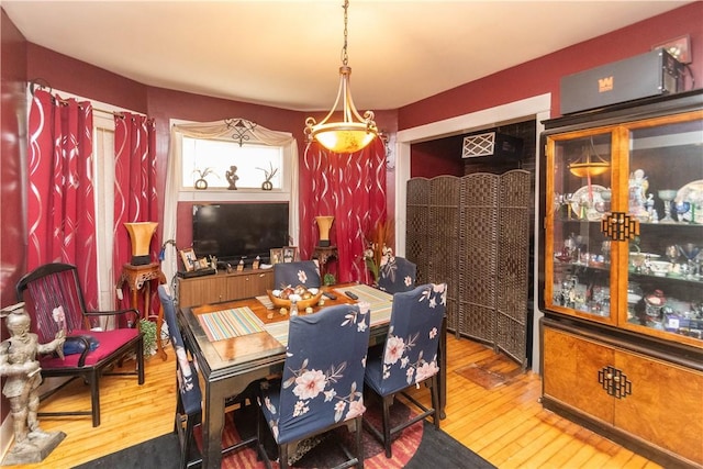 dining area featuring wood-type flooring