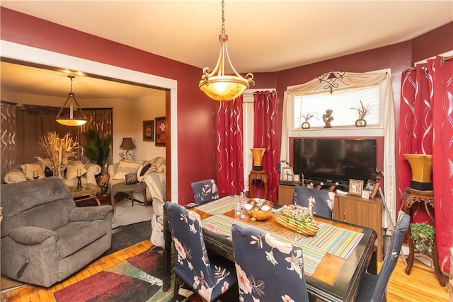 dining area with wood-type flooring