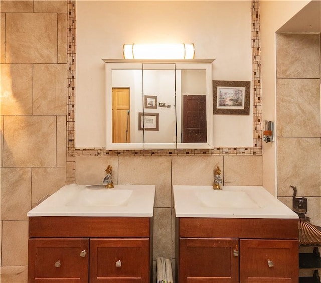 bathroom with vanity and tile walls