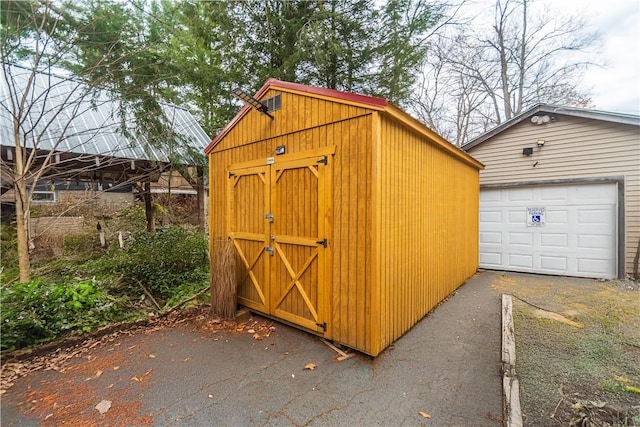 view of outbuilding with a garage