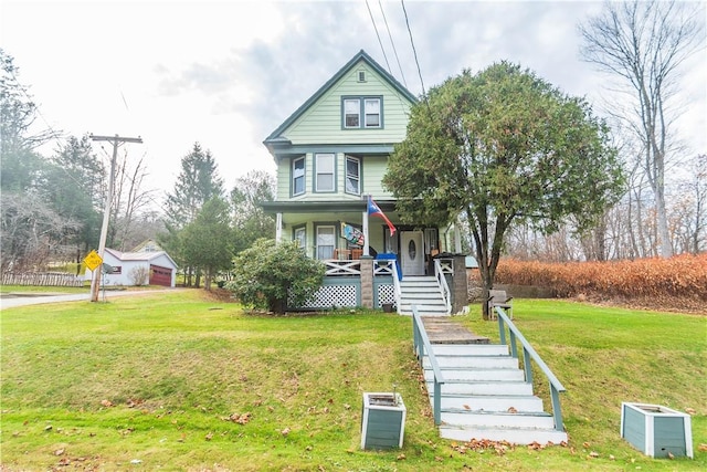 victorian home with a front yard and a porch