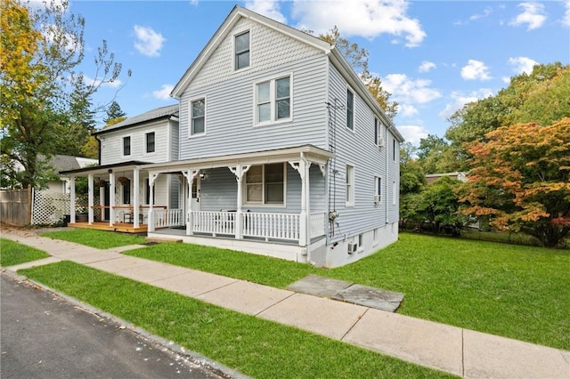 view of front facade with a porch and a front lawn